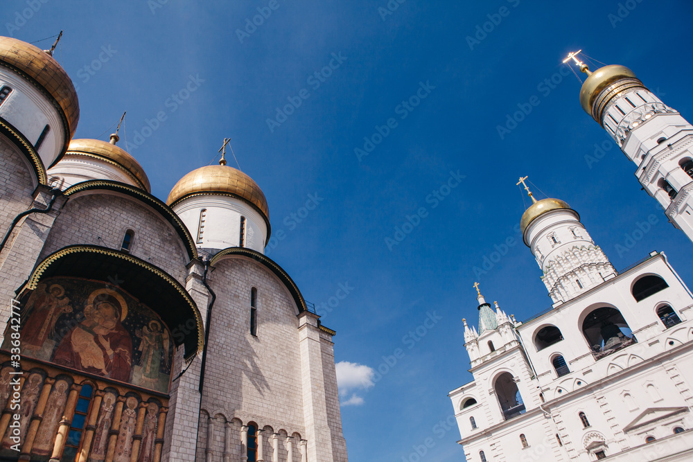 Obraz premium The Assumption Cathedral and The Ivan the Great Bell-Tower inside the Kremlin in Moscow, Russia