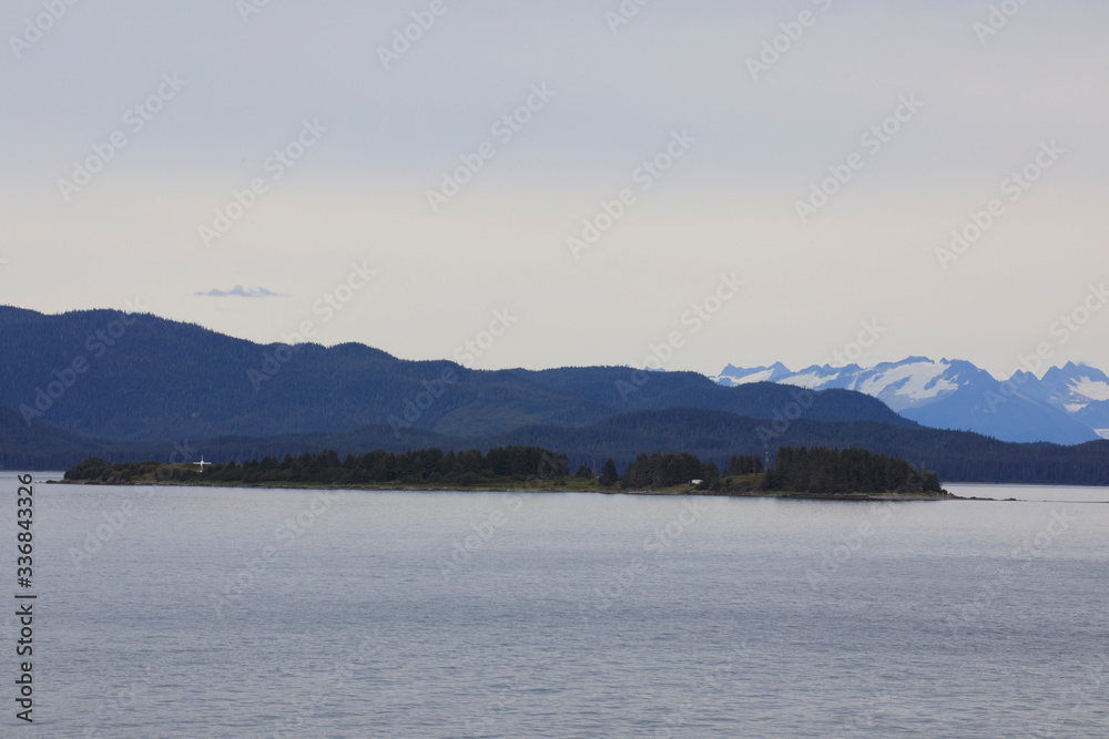 Alaska / USA - August 15, 2019: Alaska coastline view from a cruise ship deck, Alaska, USA