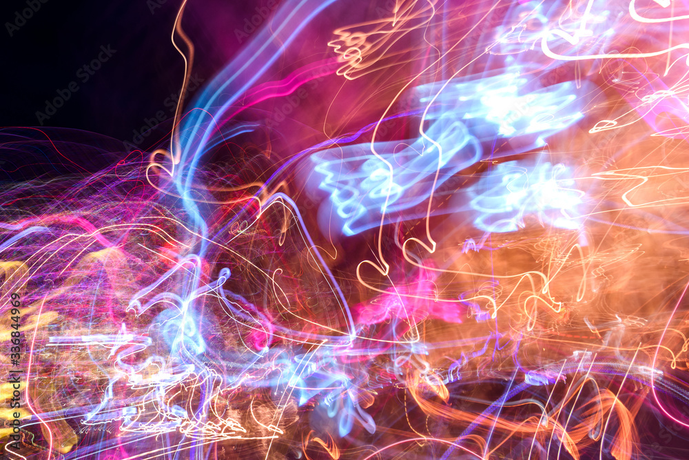 Long-exposure photo of moving colorful lights Long-exposure photo of moving colorful lights