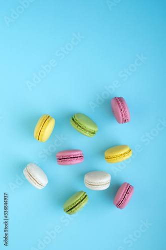 Wallpaper Mural Top view of colorful macarons on blue background Torontodigital.ca