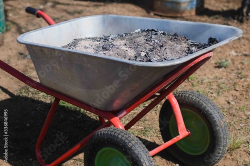 cart full of fertilizer, ashes located in the country or farm