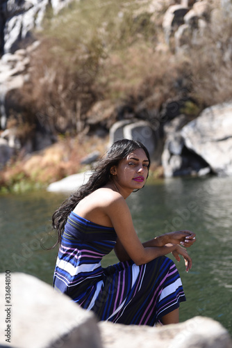 Fototapeta Naklejka Na Ścianę i Meble -  Spectacular middle eastern young woman is posing on  the Nile 