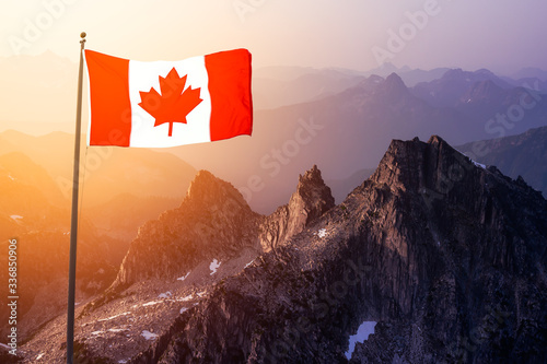 Canadian National Flag Composite over the Aerial View of Beautiful Rocky Mountain Landscape during sunny Sunset. Taken in Remote Area near Vancouver, British Columbia, Canada.