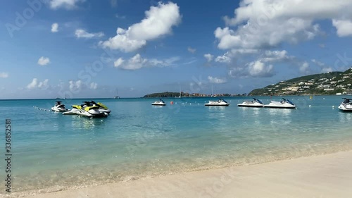 Sea jet ski doos anchored at sea bay near popular beach. View of the sea and coastline. photo