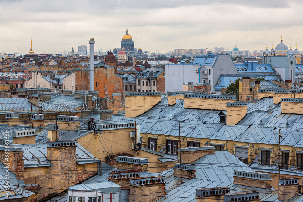 Great top view of the historic city center of St. Petersburg. Cityscape with roofs of buildings and domes of cathedrals. Landmarks of Saint-Petersburg, Russia.