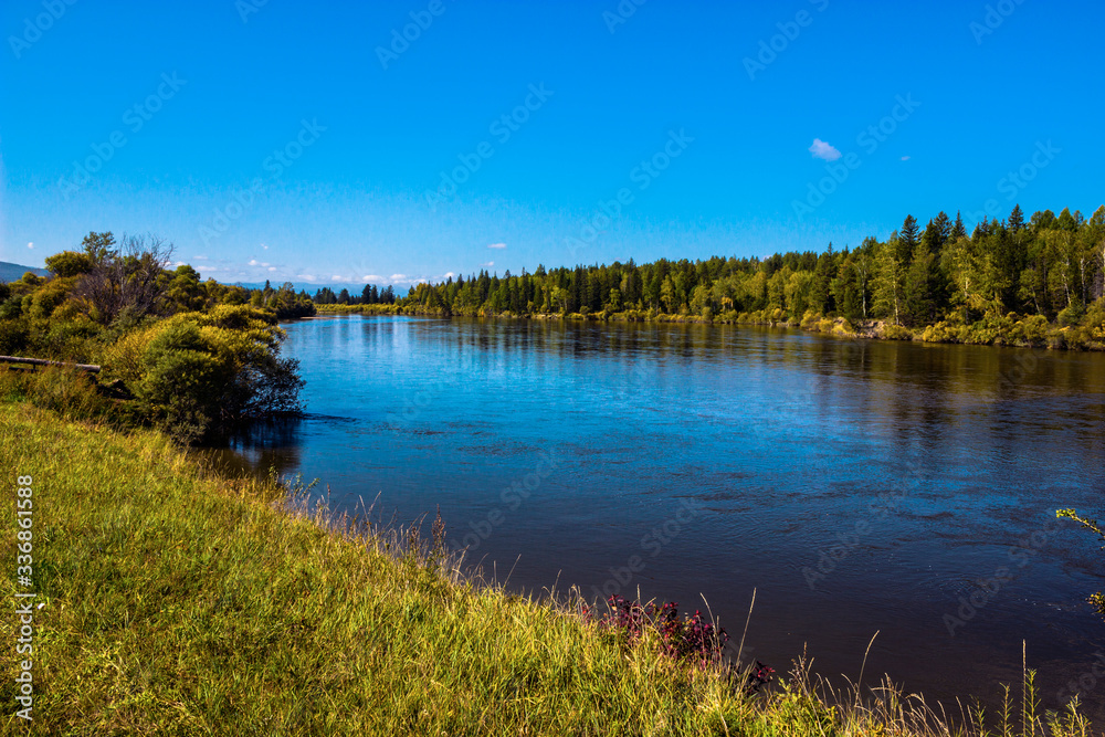 Irkutsk region, Arshan, Irkut river. Green shores, blue sky and water
Irkutsk region, Arshan, Irkut river. Green shores, blue sky and water