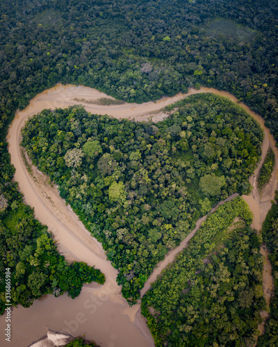 Aerial natural heart shaped river in Amazon rainforest photo