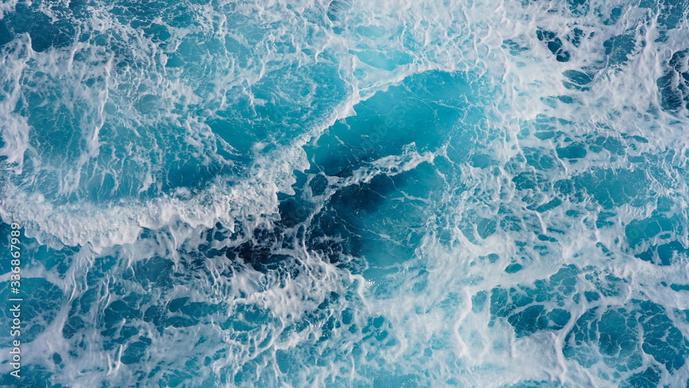 Obraz premium Abstraction of sea foam in the ocean. Light blue clear water, storm waves