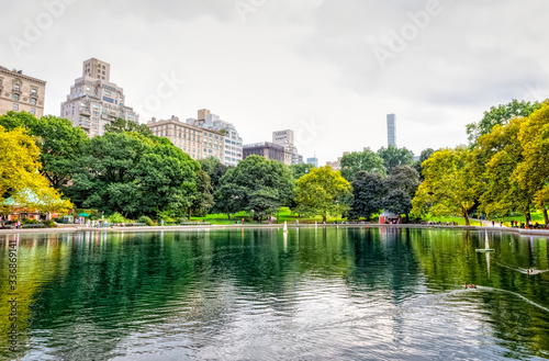 Conservatory Water pond with remote controlled sailing model boats during the gloomy weather in the Central Park, New York.
