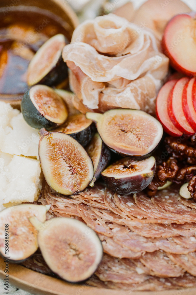A close up of ripe figs on a charcuterie plate A close up of ripe figs on a charcuterie plate
