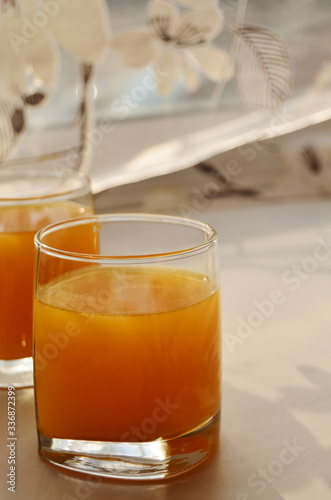 glass glass with buckthorn juice on the windowsill