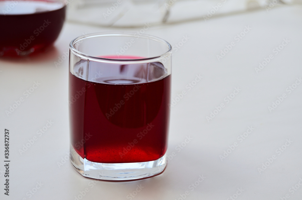glass glass with blackcurrant juice on the window glass glass with blackcurrant juice on the window