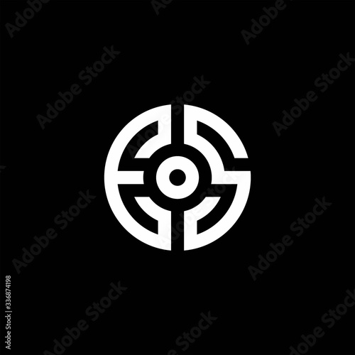ES monogram logo with abstract circle style and dot in the middle