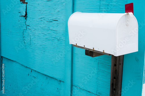 Mailbox against turquoise wall