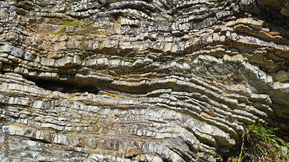 Stone texture, abstract background, uneven lines, bends of stone layers. Natural pattern for your product. wavy structure of layers of stone Stone texture, abstract background, uneven lines, bends of stone layers. Natural pattern for your product. wavy structure of layers of stone
