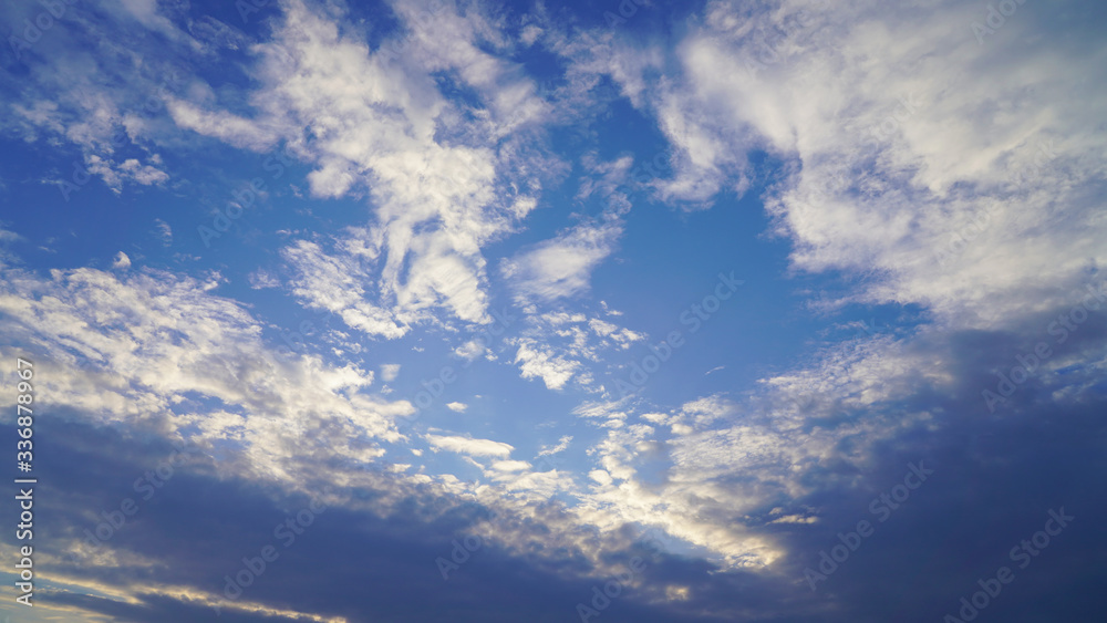 dramatic sky, dark clouds on a blue sky, the rays of the sun pass through the clouds in lines. glow of heaven at sea. ocean dramatic sky, dark clouds on a blue sky, the rays of the sun pass through the clouds in lines. glow of heaven at sea. ocean