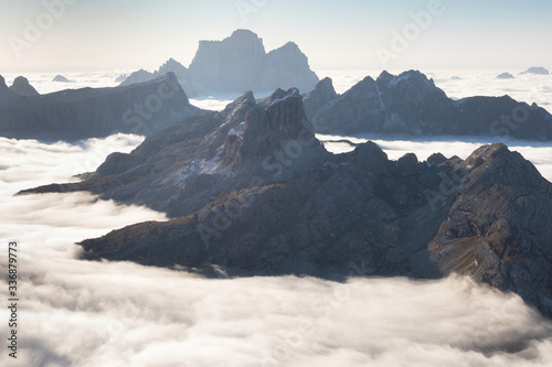View of famous Dolomites mountain peaks glowing in beautiful golden morning light at sunrise in summer  South Tyrol Italy dramatic view of dolomites mountains above the clouds Famous best alpine place