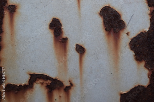 White steel sheet that is scratched and has rust stains