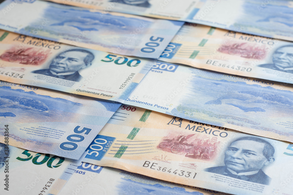 Mexican 500 pesos pile of blue bucks stack on top left