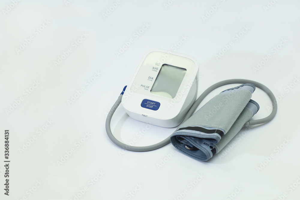 Blood pressure monitor device on a white background Blood pressure monitor device on a white background