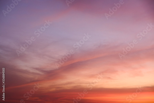 sunset sky shading background from orange to blue © Pop