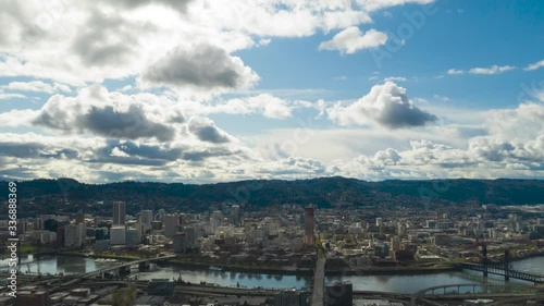 Aerial Timelapse pans Across Portland Oregon Cityscape as Clouds Develop And Pass Overhead in Typical Display of Pacific Northwest Spring Weather photo