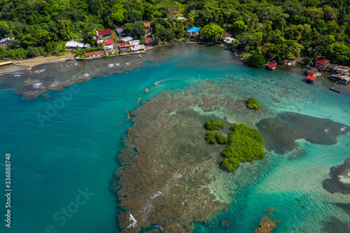 Aerial shot of Panama coastline landscape with island, yachts and clear sea with turquoise water. Drone photo. Top view.