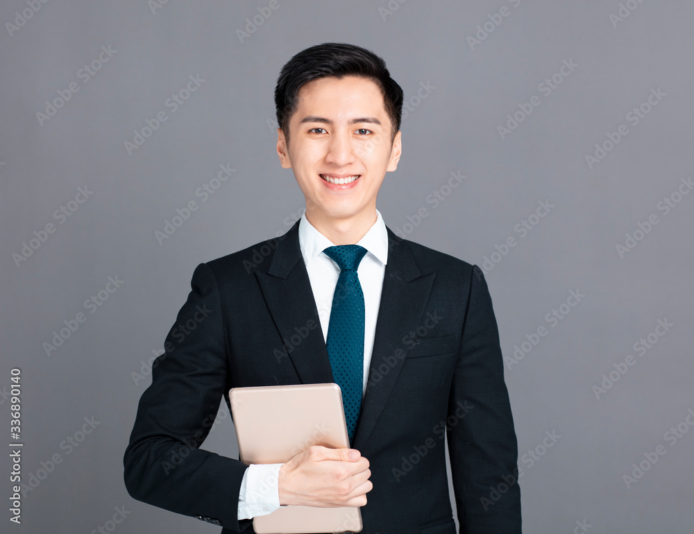 young business man holding the digital tablet young business man holding the digital tablet