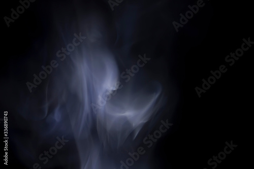 White smoke on a black background © theeraphong