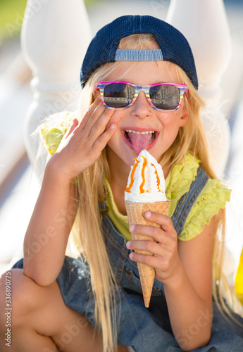 Kid eating ice cream outdoors