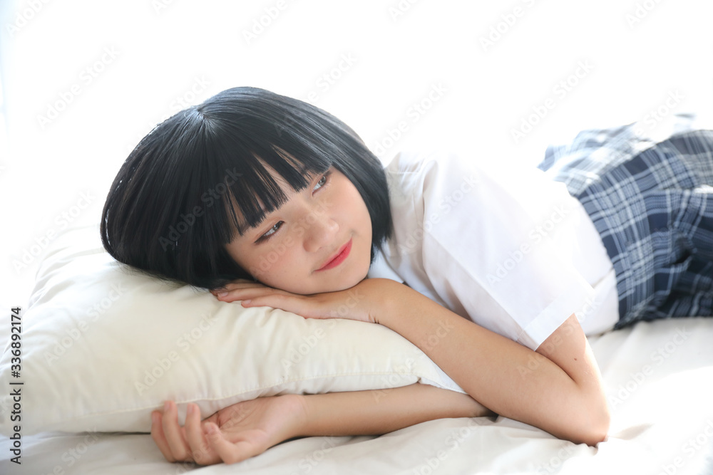 Portrait japanese school girl in white tone bed room Portrait japanese school girl in white tone bed room
