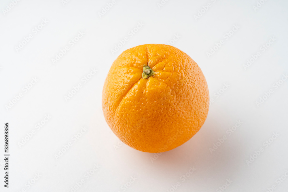 fresh oranges on a white background close up fresh oranges on a white background close up