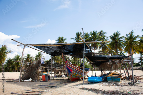 View landscape and wind with Kolek or Koleh traditional fishing boat of lower southern provinces of thai at Banton Beach on August 16, 2019 in Narathiwat, Thailand photo