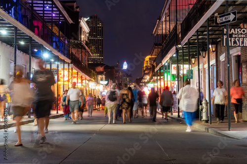 people walking on Bourbon street photo