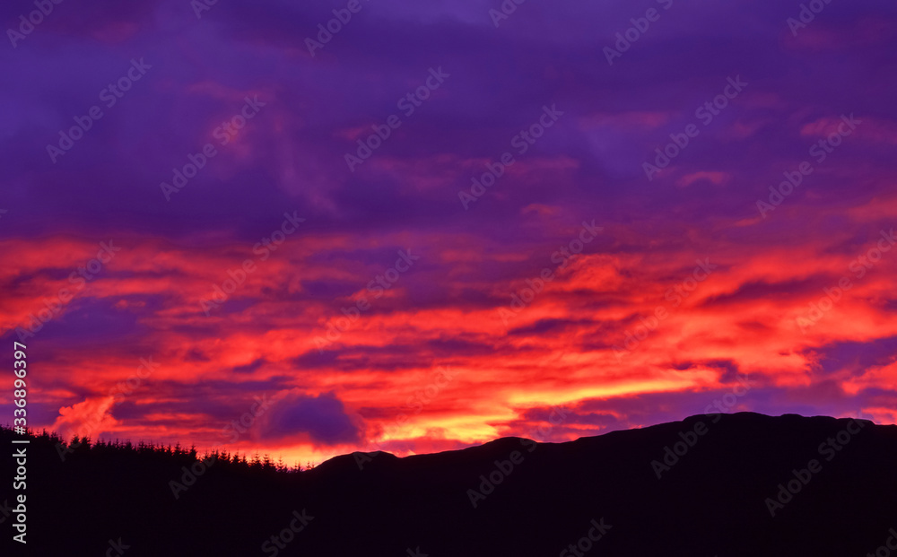 Amazing colourful sunset sky in the north of the Island of Skye in the Highlands of Scotland Amazing colourful sunset sky in the north of the Island of Skye in the Highlands of Scotland