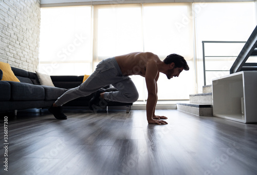 Side View Athletic White Young Man Doing Abs Workout Home