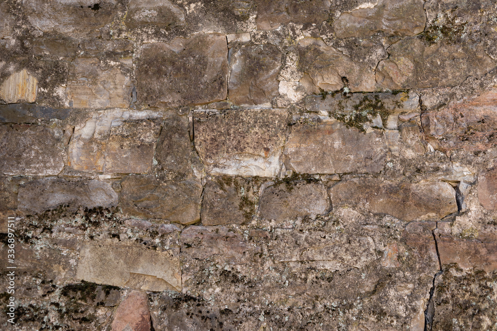 The texture of the stone wall. old wall of stone and cement. The texture of the stone wall. old wall of stone and cement.