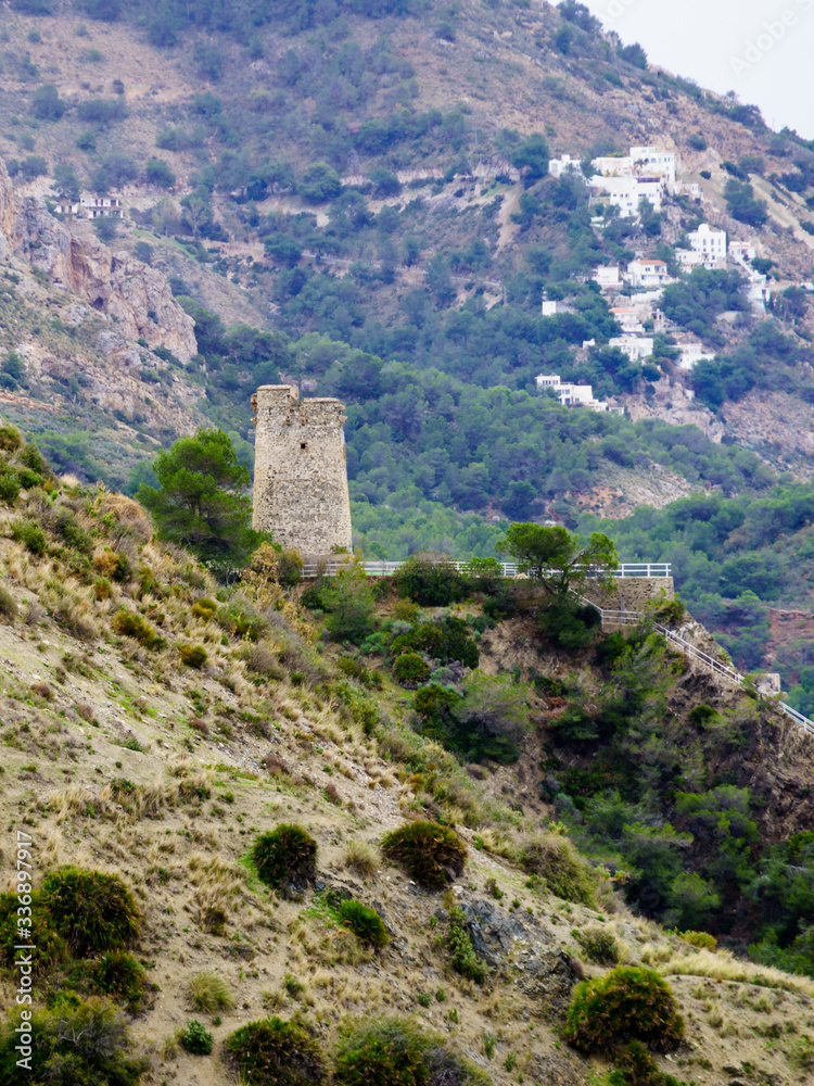 Tower on rocky coast, seaside cliffs, Spain