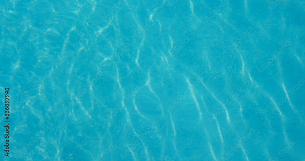 Blue water wave texture in swimming pool