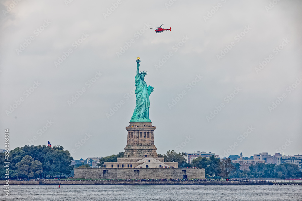 Statue of Liberty on Liberty Island during the gloomy weather in New York. Statue of Liberty on Liberty Island during the gloomy weather in New York.