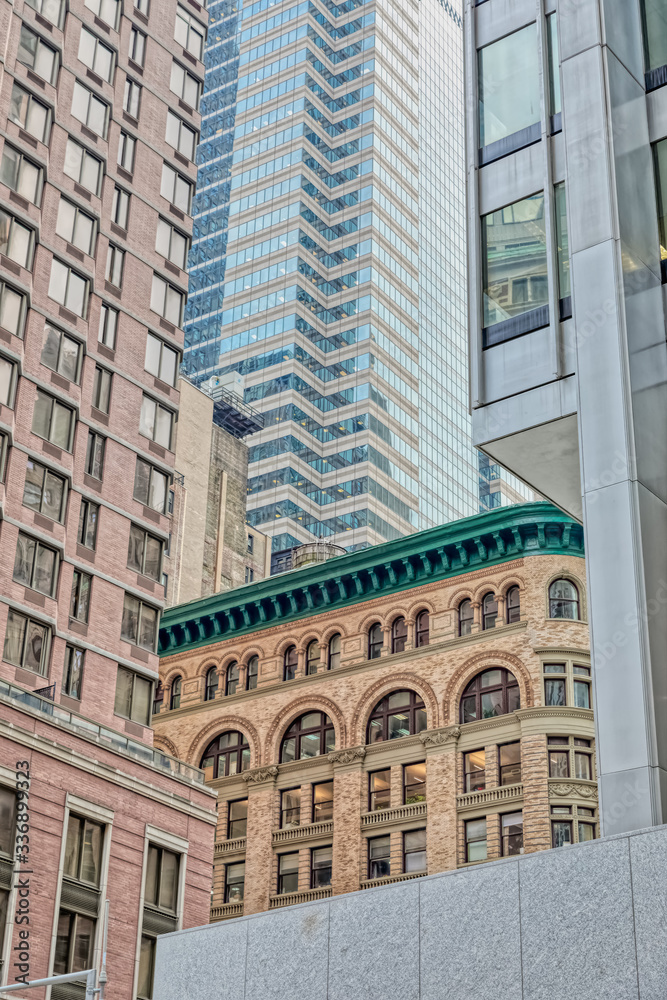 Architectural detail of Manhattan building facade on Liberty Plaza Square during the gloomy weather, New York. Architectural detail of Manhattan building facade on Liberty Plaza Square during the gloomy weather, New York.