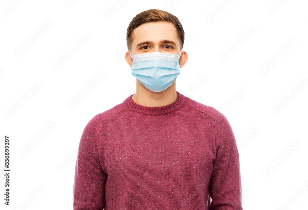 health, quarantine and pandemic concept - young man wearing protective medical mask for protection from virus disease over grey background health, quarantine and pandemic concept - young man wearing protective medical mask for protection from virus disease over grey background