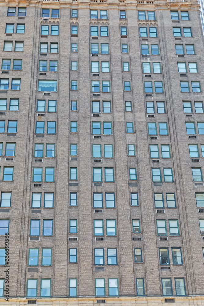 NEW YORK, USA - JANUARY 15, 2018: Apartment building facade in Midtown Manhattan Fifth Avenue on sunny winter day.