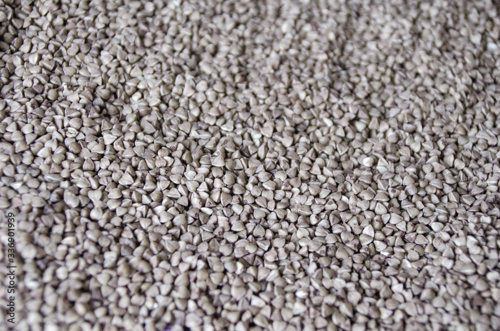 Scattered buckwheat groats, texture Scattered buckwheat groats, texture