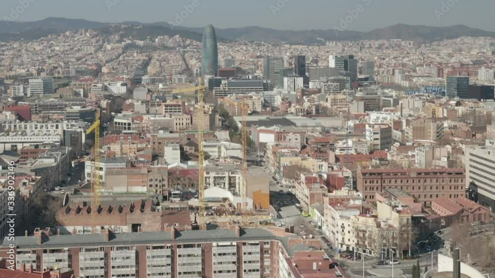 AERIAL: Barcelona Wide Drone Shot of City Towards Center with La Sagrada Familia and Torre Glories, Torre Agbar AERIAL: Barcelona Wide Drone Shot of City Towards Center with La Sagrada Familia and Torre Glories, Torre Agbar