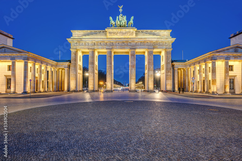 The illuminated Brandenburger Tor in Berlin at dawn with no people
