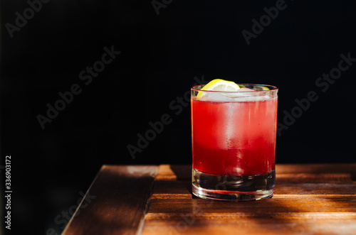 Red cocktail with ice