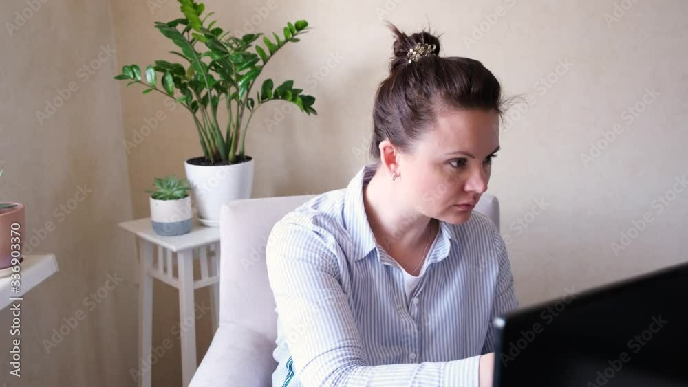 Female programmer or freelancer working from home, remote, home office. Remote work concept - 4k footage. Female programmer or freelancer working from home, remote, home office. Remote work concept - 4k footage.
