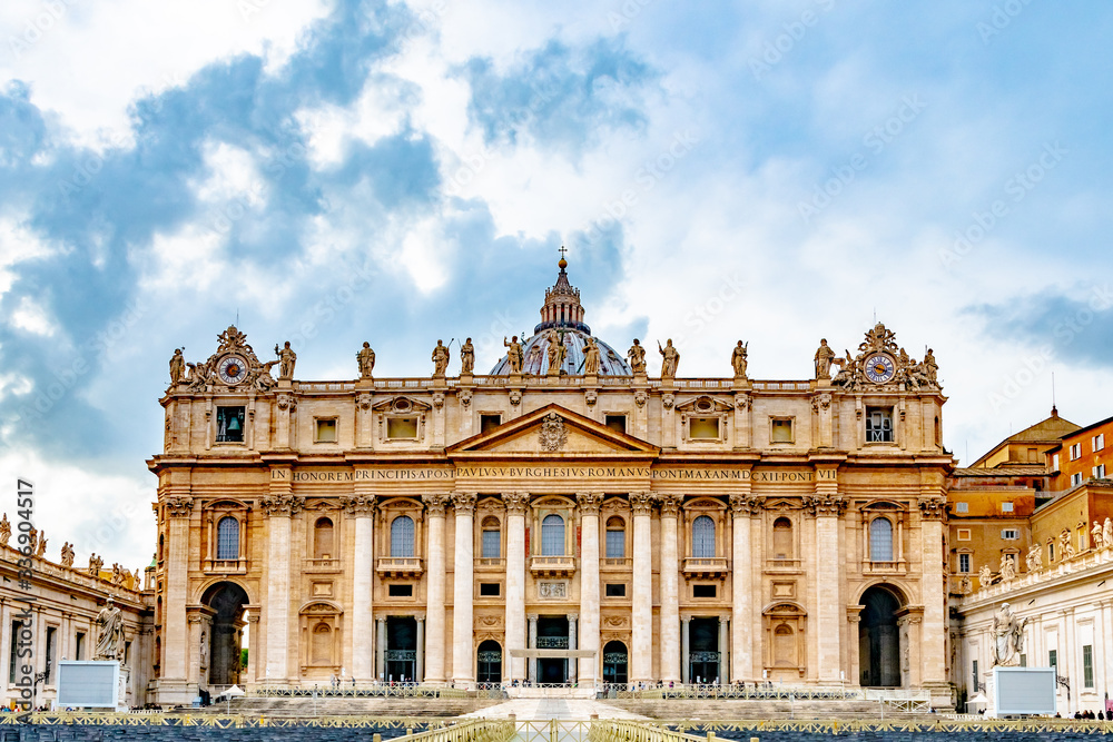 Rome, Italy. Papal Basilica of Saint Peter in St Peters Square, Vatican City. Old religious Italian/ Roman architecture landmark building with statues of Saints. Famous Renaissance Church/ Cathedral.