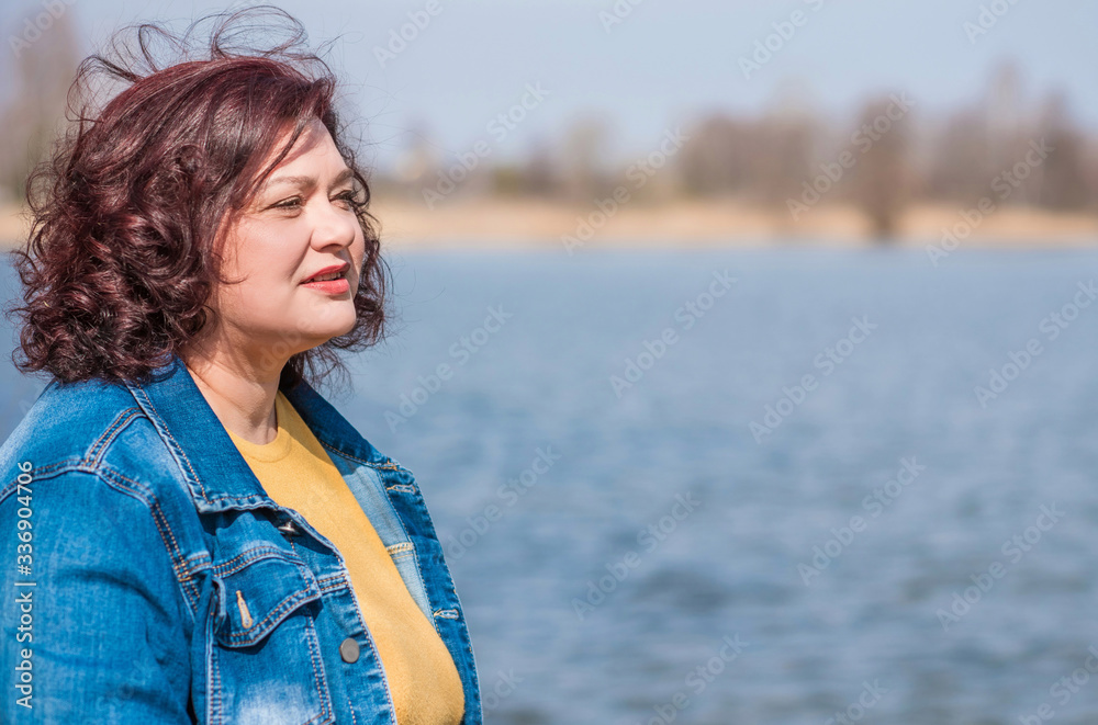 Beautiful mature woman on a walking. A nice middle aged plus size woman standing on the street. Plump women lifestyle Beautiful mature woman on a walking. A nice middle aged plus size woman standing on the street. Plump women lifestyle
